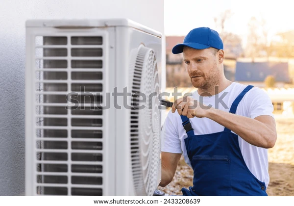 Technician Working On AC